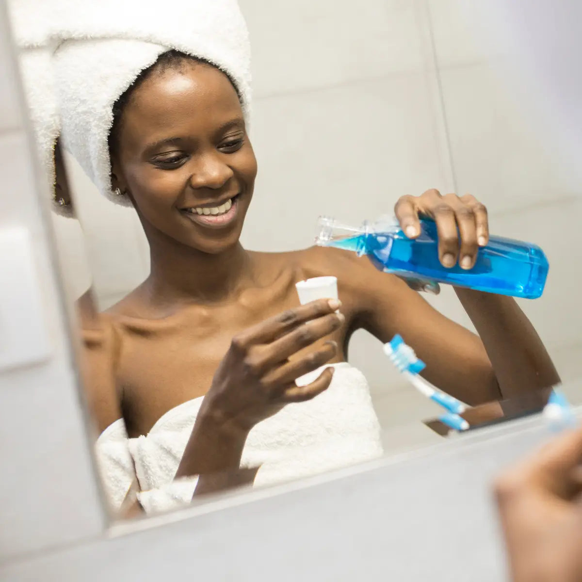 woman with mouthwash